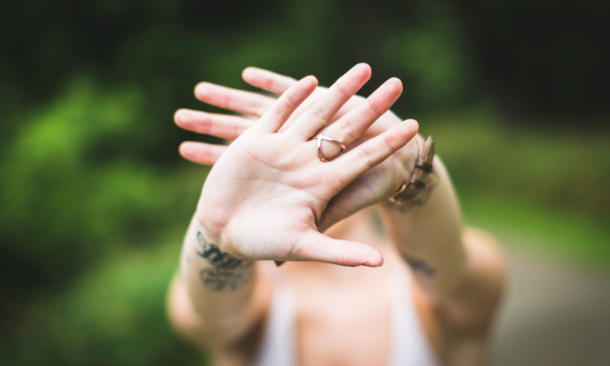 Tattoo Removal Hands Blocking Face